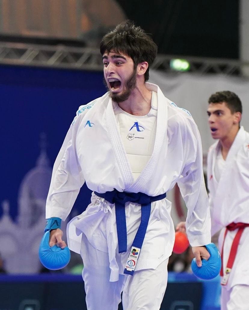 Ahmedov Ahmed celebrating a scored point during a bout.