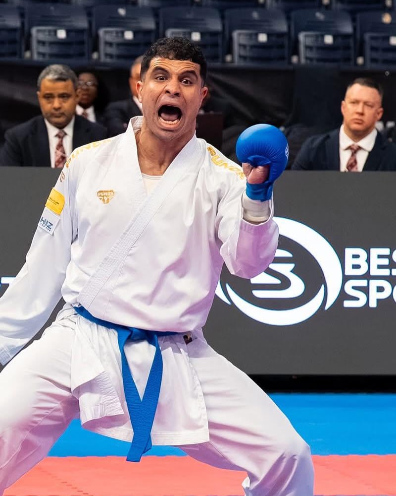 Youssef Badawy mid-kiai with his lead fist raised during a bout.